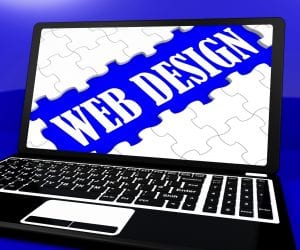 Web Design Puzzle On Notebook Shows Online Creativity And Content