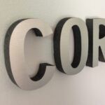 brushed metal sign for business