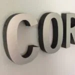 brushed metal sign for business
